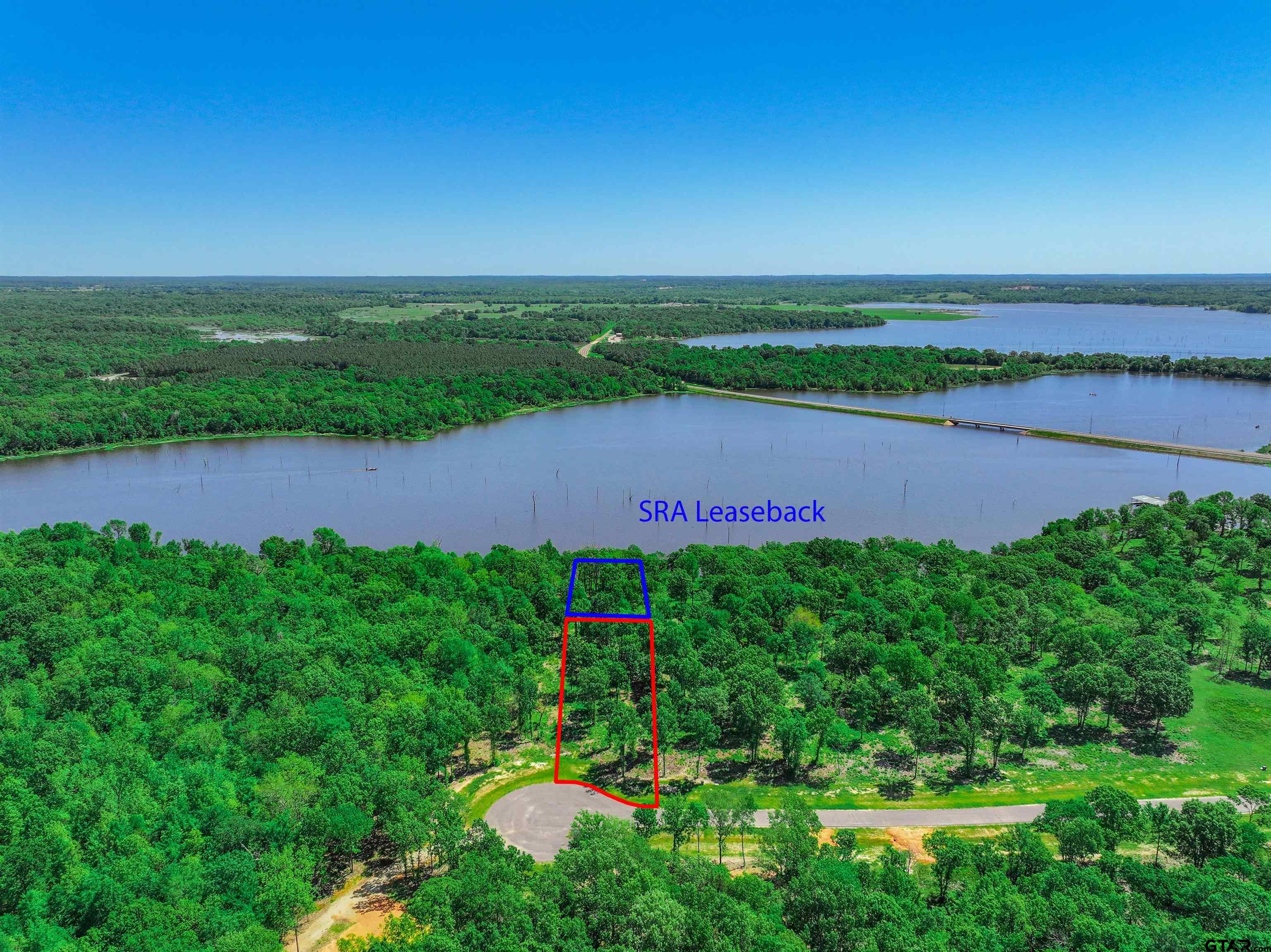 5862 Yantis Tx 75497 Yantis, TX 75497 - Photo 6 of 23 a view of a lake with a yard