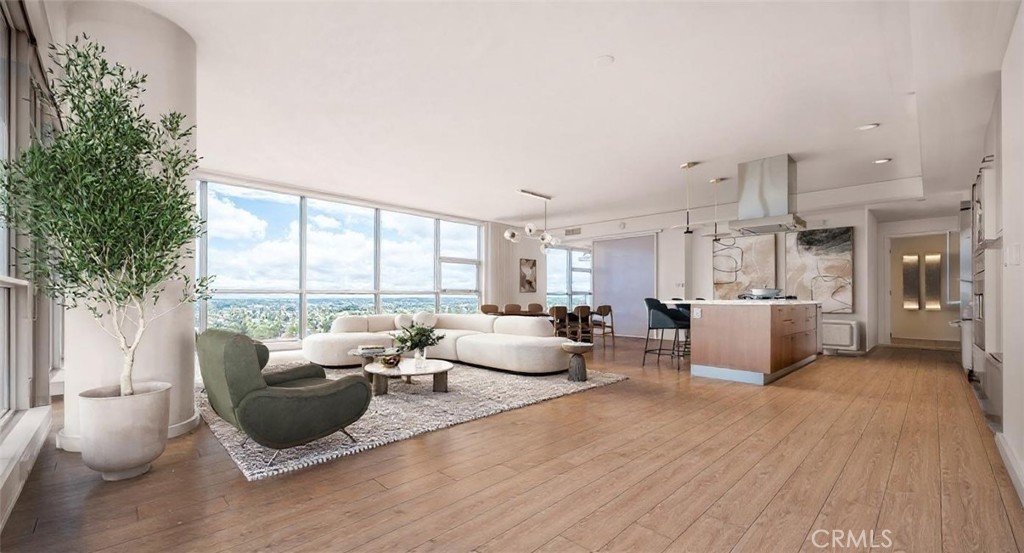 9 Mac Arthur Place, Unit 807 Santa Ana, CA 92707 - Photo 2 of 13 a living room with furniture and a large window