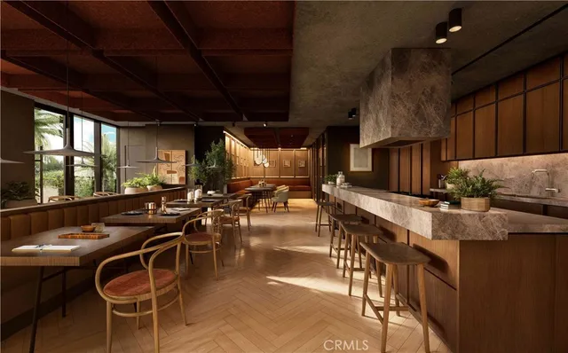 a kitchen with table chairs stove and flat screen tv