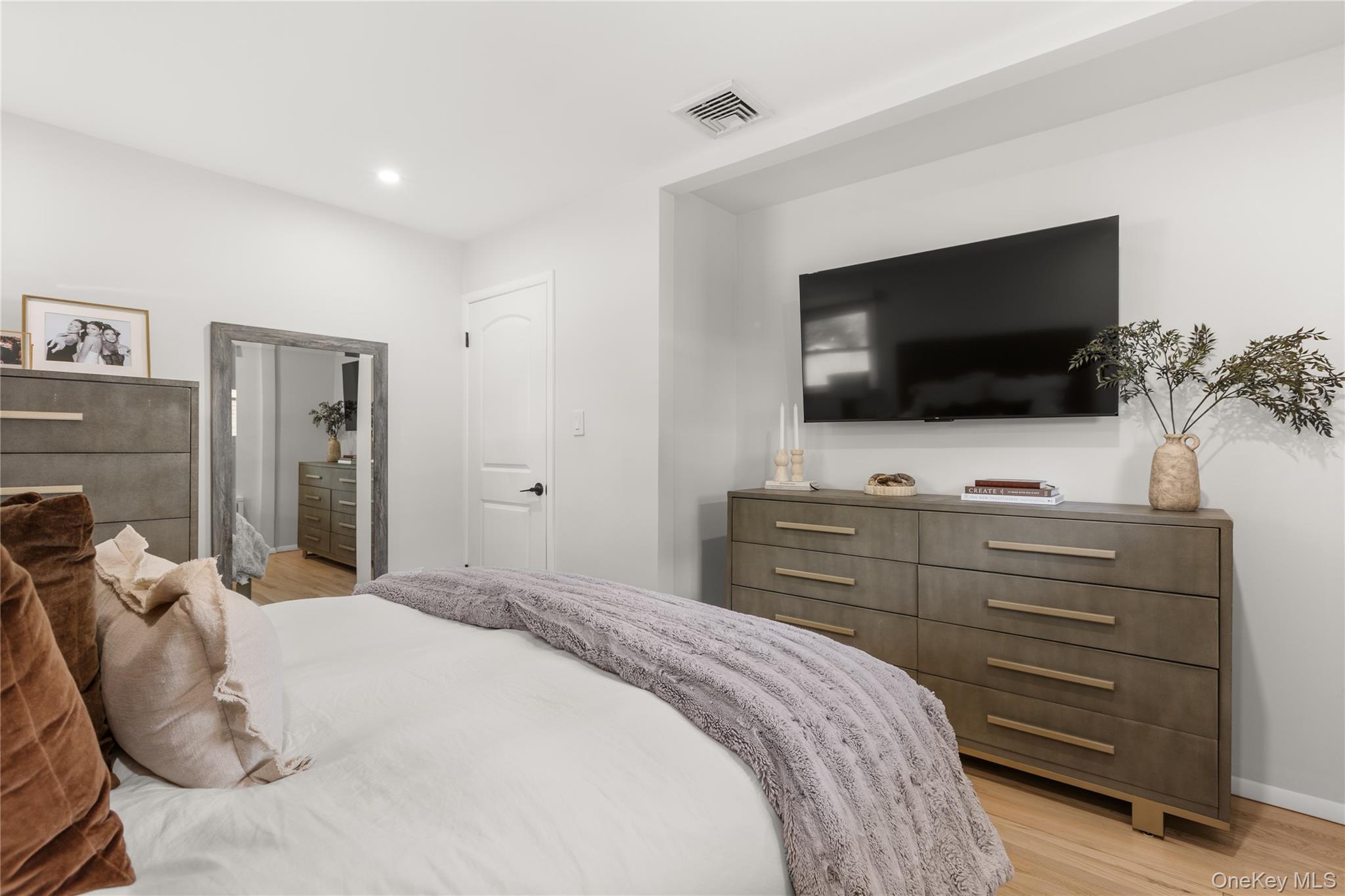 205 Timber Point Road East Islip, NY 11730 - Photo 8 of 16 Bedroom with light wood-type flooring and recessed lighting