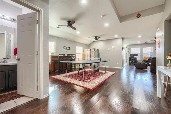 a living room with kitchen island furniture and a wooden floor