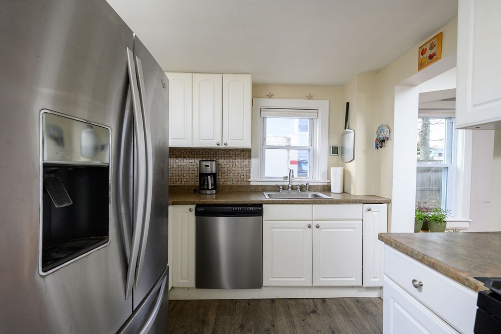 134 Hampton Circle Hull, MA 02045 - Photo 16 of 41 a kitchen with stainless steel appliances granite countertop a refrigerator and a sink