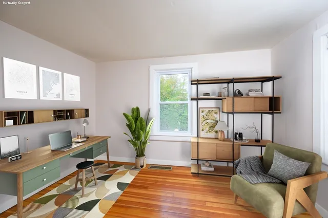 a bedroom with furniture and a window