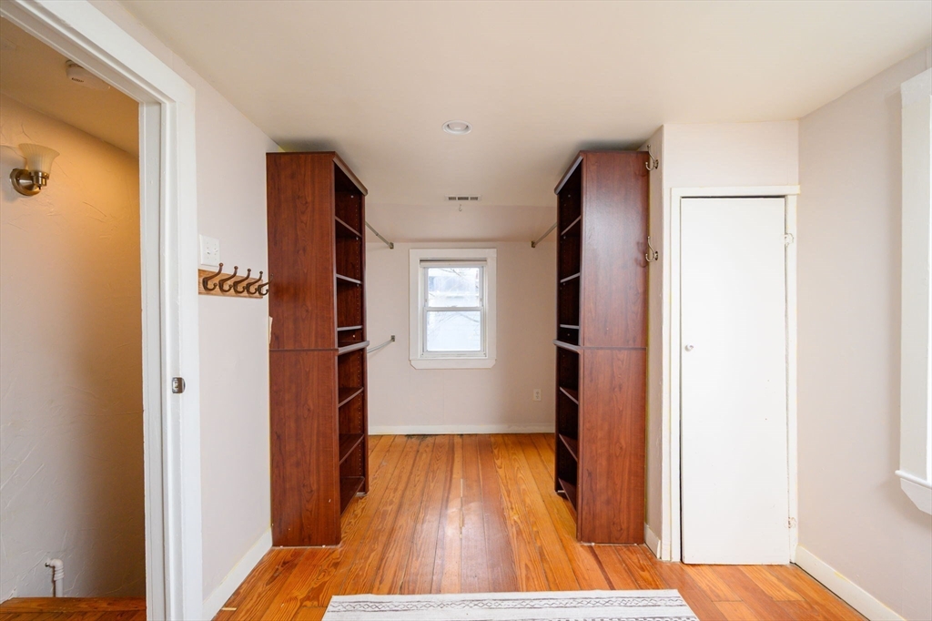 134 Hampton Circle Hull, MA 02045 - Photo 21 of 41 a view of wooden floor in an empty room