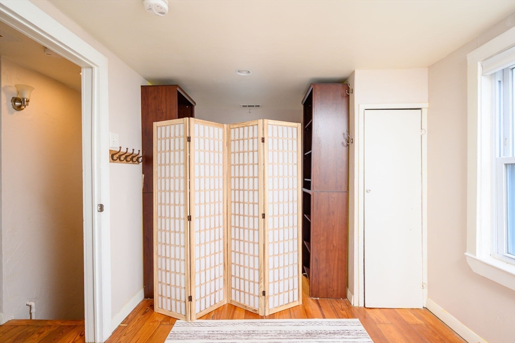 134 Hampton Circle Hull, MA 02045 - Photo 22 of 41 a view of bedroom with window and wooden floor