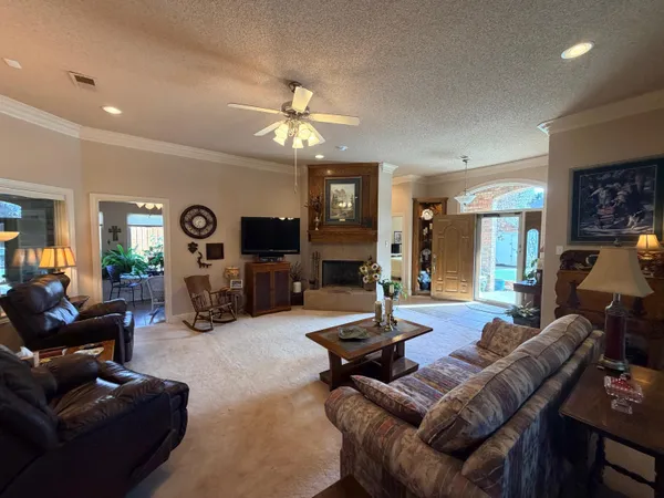 a view of a hallway and dining room with wooden floor