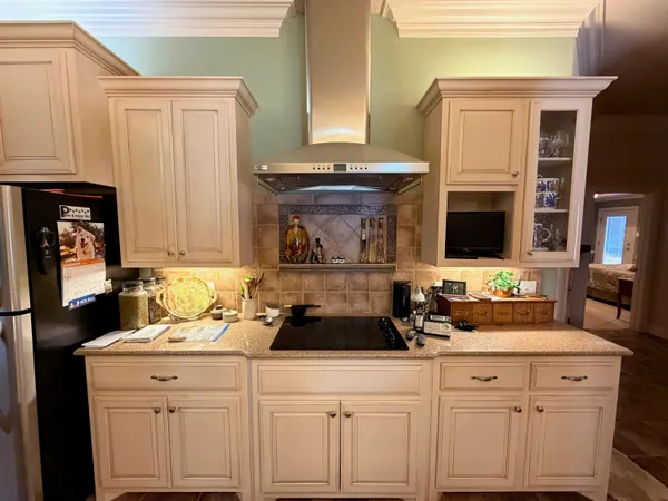 a kitchen with a sink cabinets and window