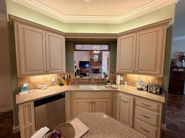 a kitchen with stainless steel appliances a stove microwave and a refrigerator