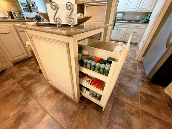 a view of a dining room with furniture and a potted plant