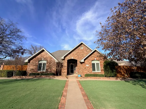 a front view of a house with yard