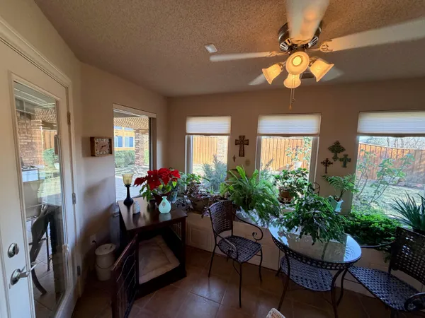 a bedroom with a bed gym equipment and a mirror