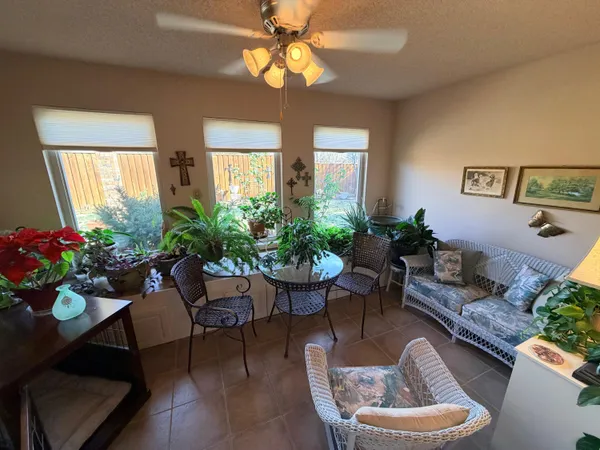 a bedroom with furniture and a flat screen tv