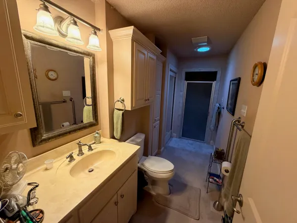 a bathroom with a tub and toilet