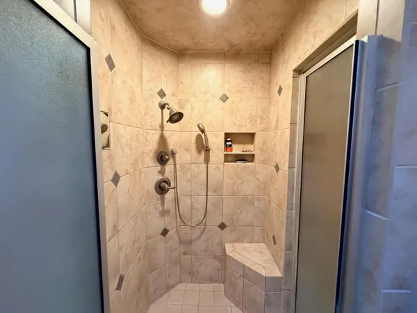 a bedroom with a bed and a couch