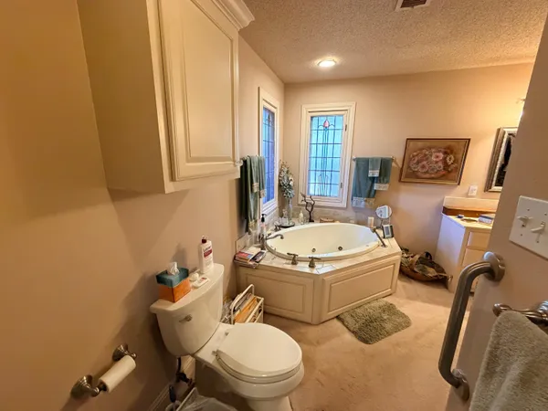 a bathroom with a tub and shower