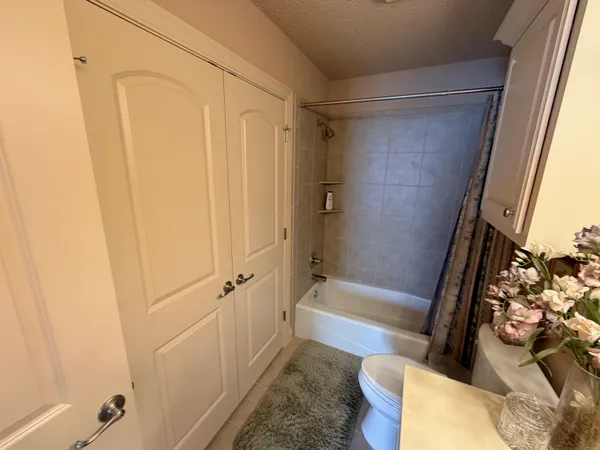 a view of a house with backyard porch and sitting area
