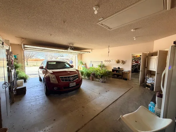 a view of a chairs and table in a patio