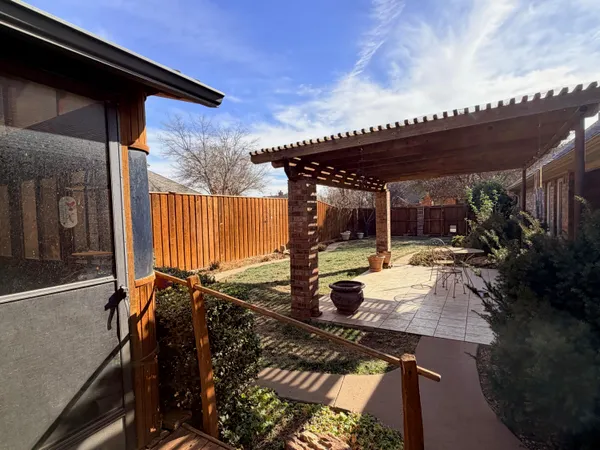 a table and chairs in patio of a patio