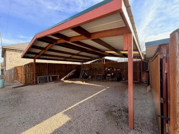 a view of a backyard with sitting area