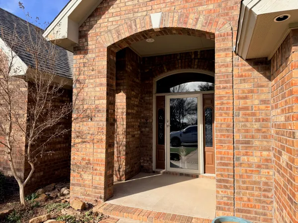 a front view of a house with glass windows