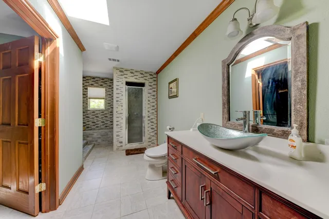 a bedroom with two beds and a large window