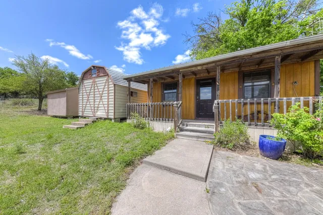a bedroom with furniture and a large window