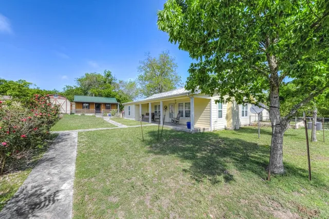 a bedroom with a bed and glass windows