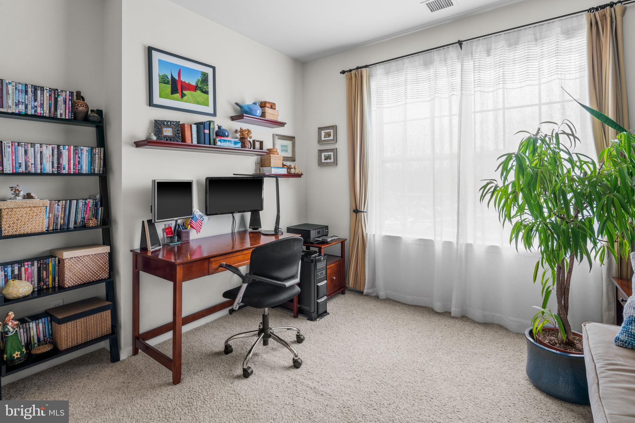 227 Timberlake Drive Ewing, NJ 08618 - Photo 17 of 21 a view of a workspace with bookshelf and a window