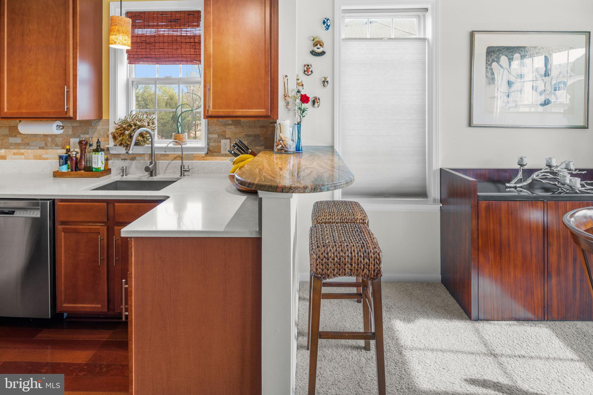 227 Timberlake Drive Ewing, NJ 08618 - Photo 10 of 21 a kitchen with stainless steel appliances granite countertop a stove and a microwave