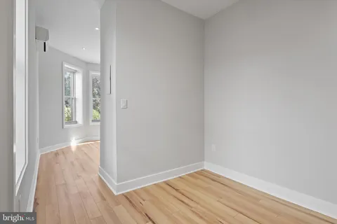 a bathroom with a granite countertop sink a toilet and a shower