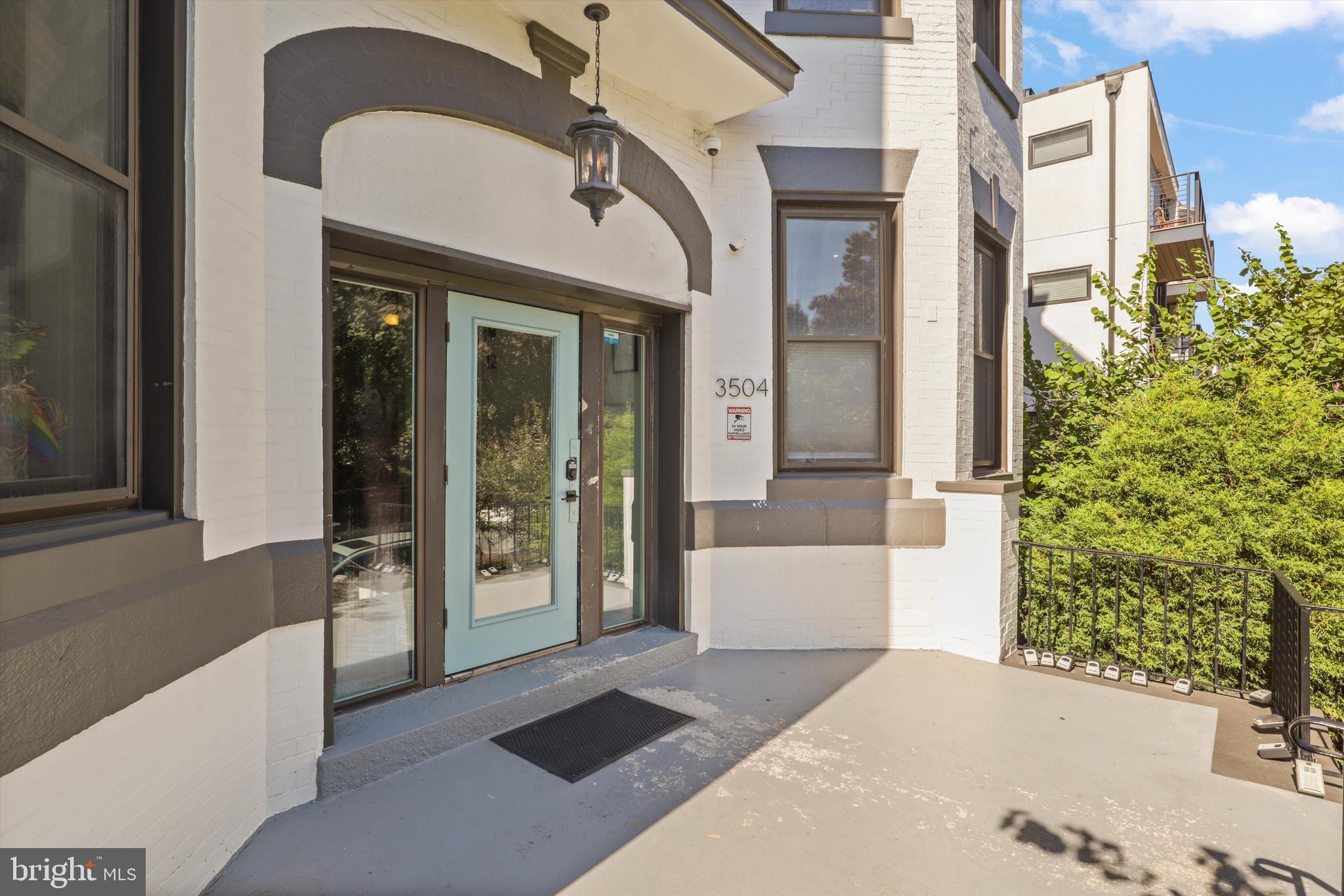 3504 13th Street Northwest, Unit 12 Washington, DC 20010 - Photo 17 of 24 a front view of a house with a plants