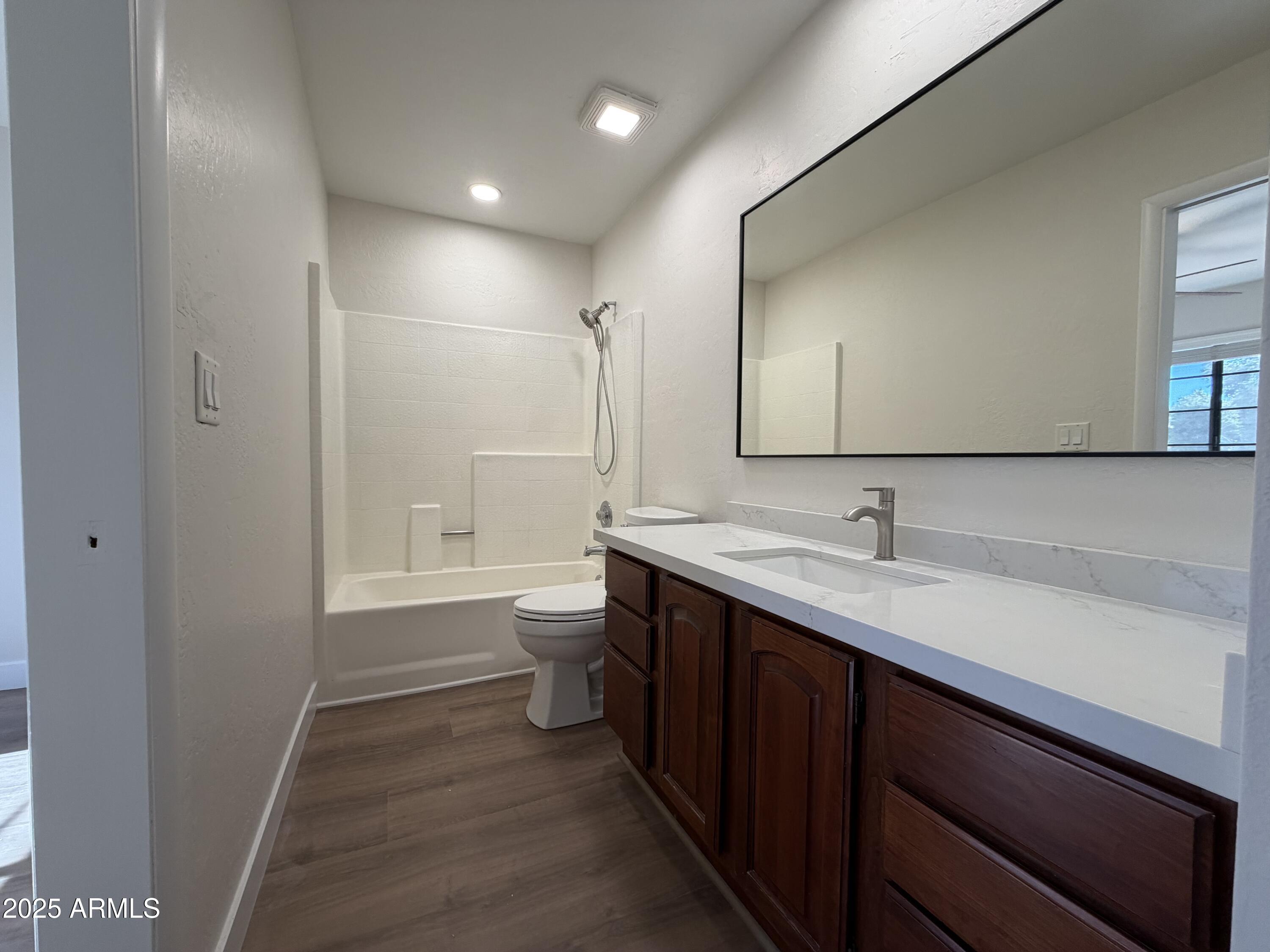 4434 East Annette Drive Phoenix, AZ 85032 - Photo 22 of 27 a bathroom with a sink a toilet and shower