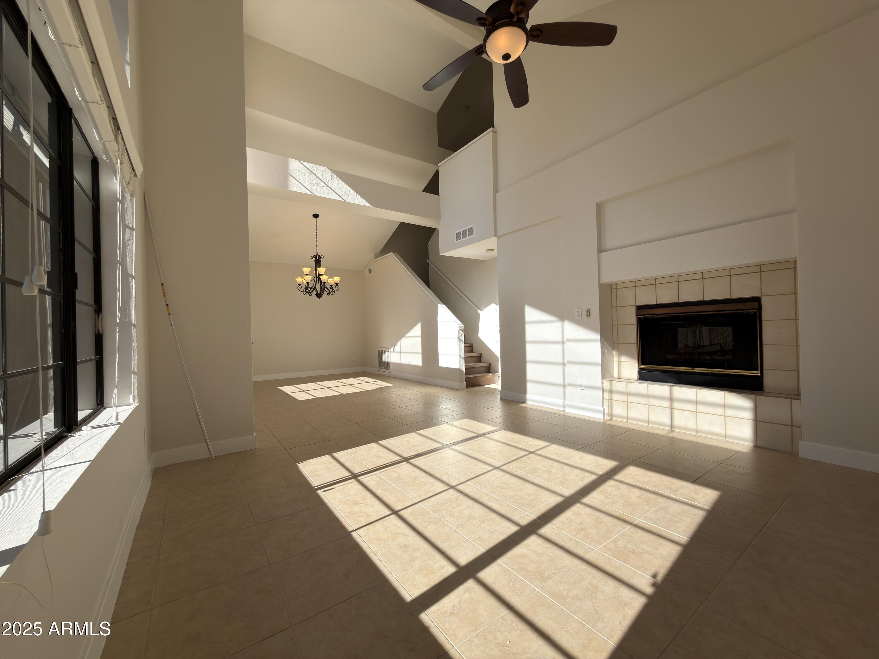 4434 East Annette Drive Phoenix, AZ 85032 - Photo 4 of 27 a living room with a flat screen tv and a fireplace