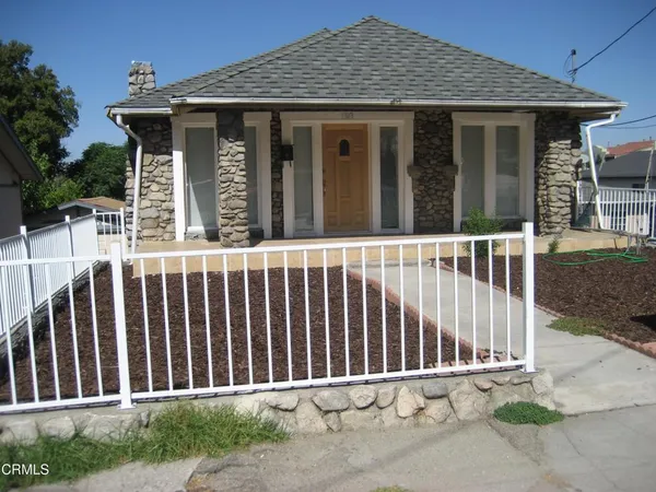 a porch with a small yard