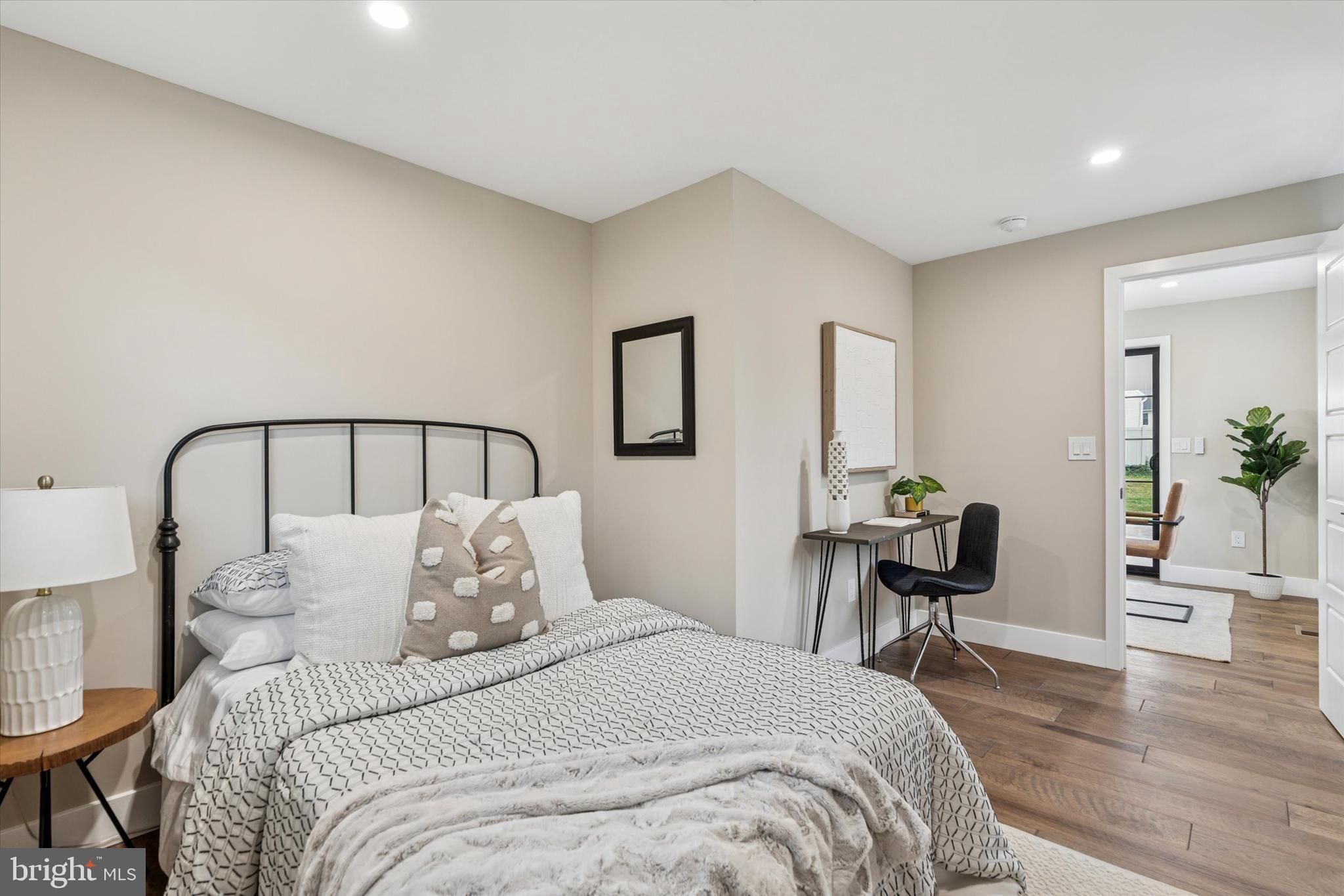 306 Greenhill Road West Chester, PA 19380 - Photo 16 of 42 a bedroom with a bed a table and chair