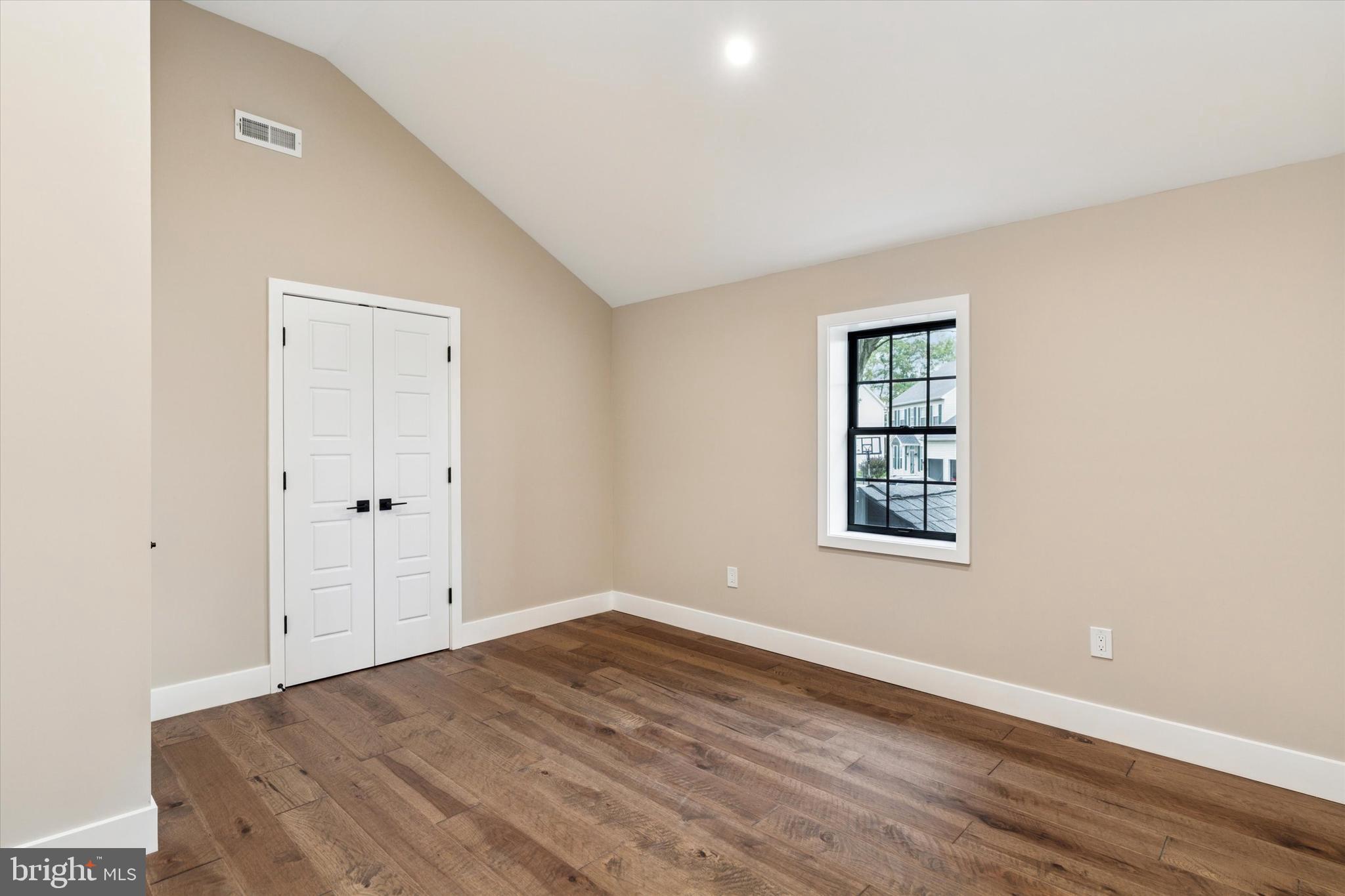 306 Greenhill Road West Chester, PA 19380 - Photo 20 of 42 an empty room with wooden floor and windows