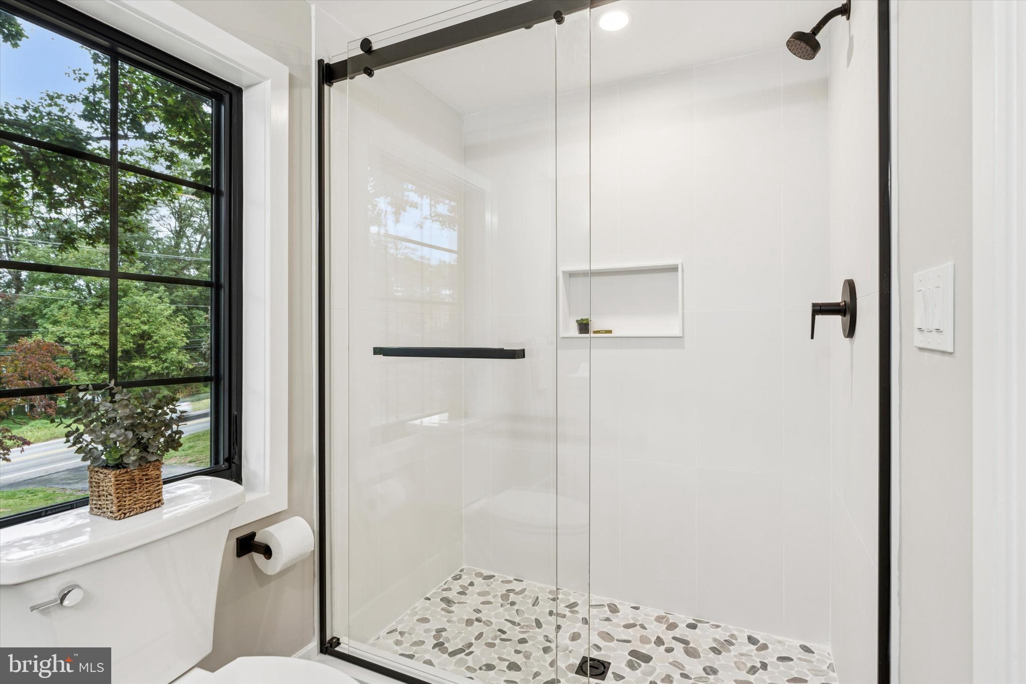 306 Greenhill Road West Chester, PA 19380 - Photo 21 of 42 a bathroom with a shower and a toilet