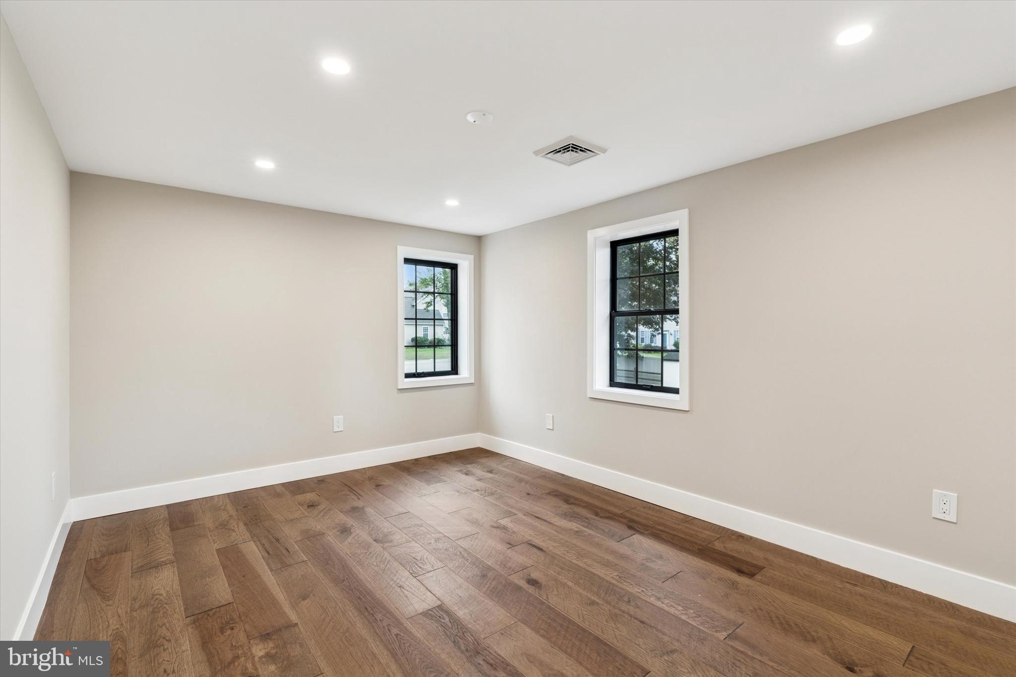 306 Greenhill Road West Chester, PA 19380 - Photo 23 of 42 a view of an empty room with wooden floor and a window