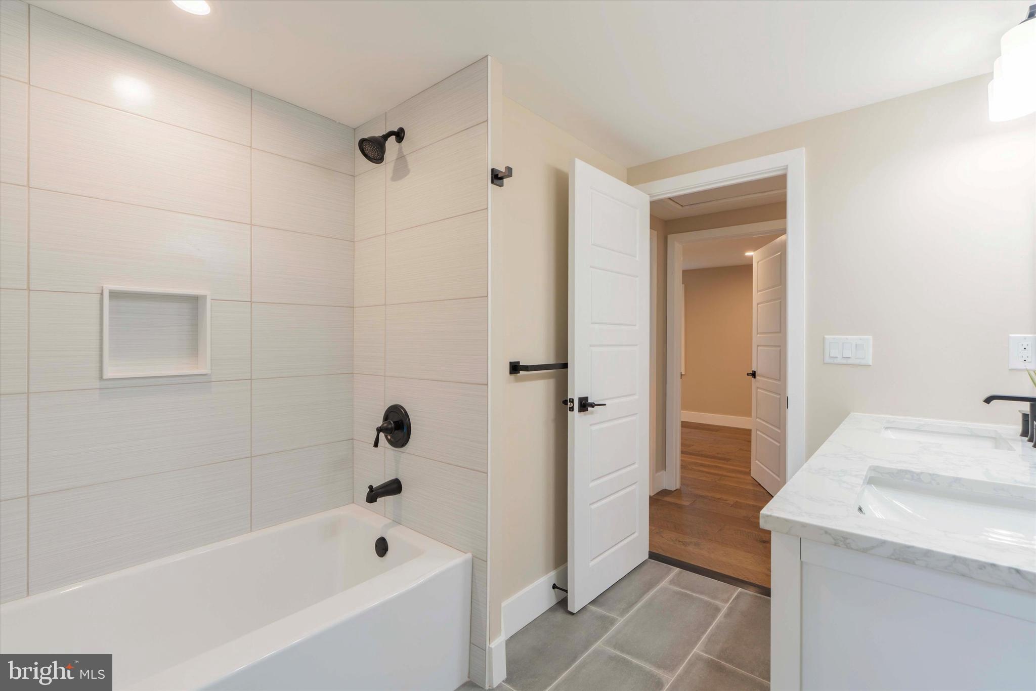 306 Greenhill Road West Chester, PA 19380 - Photo 25 of 42 a bathroom with a bathtub a toilet and a shower