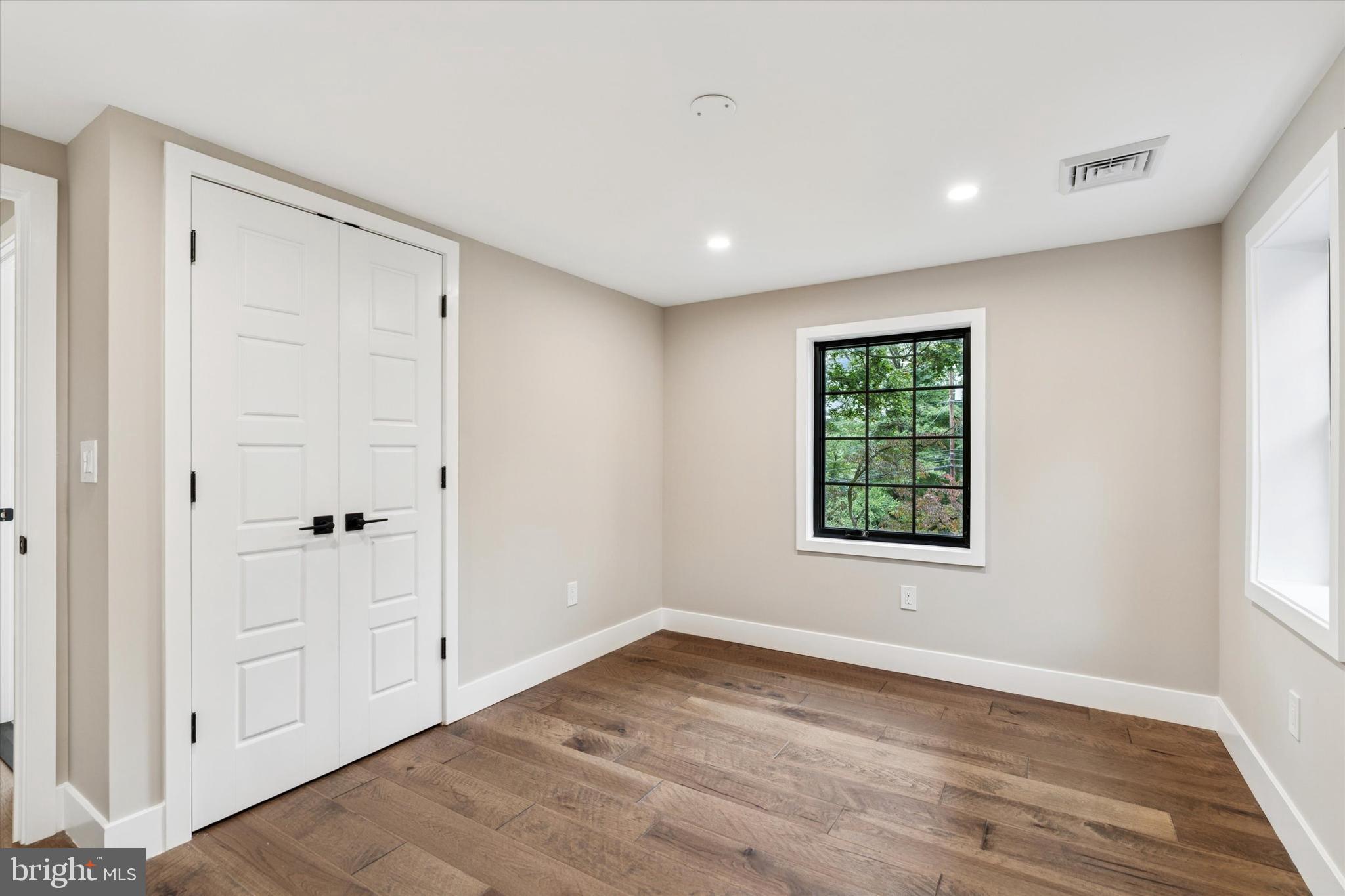 306 Greenhill Road West Chester, PA 19380 - Photo 26 of 42 a view of an empty room with wooden floor and a window
