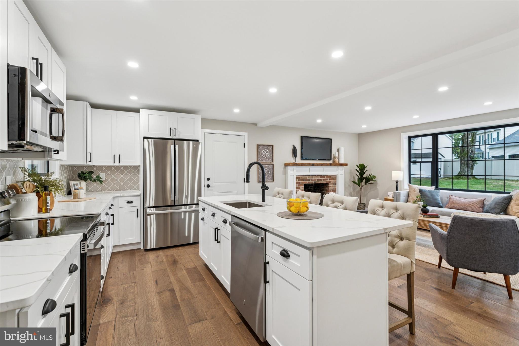 306 Greenhill Road West Chester, PA 19380 - Photo 9 of 42 a kitchen that has a lot of cabinets a sink and appliances in it