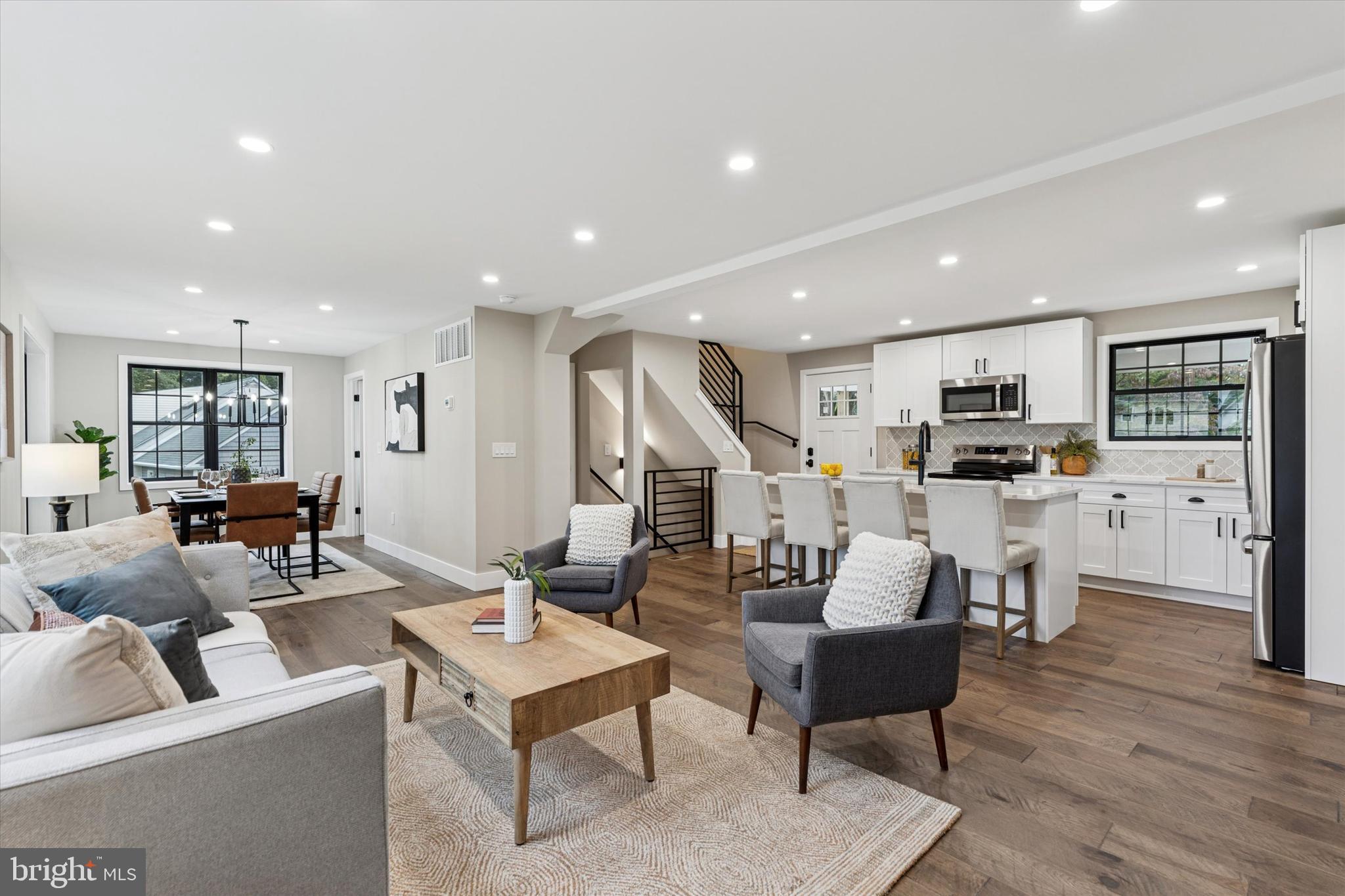 306 Greenhill Road West Chester, PA 19380 - Photo 10 of 42 a living room with furniture kitchen view and a wooden floor