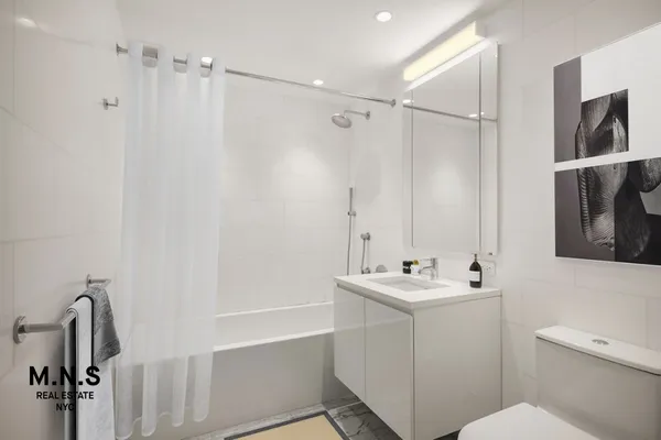 a view of a hallway with washer and dryer