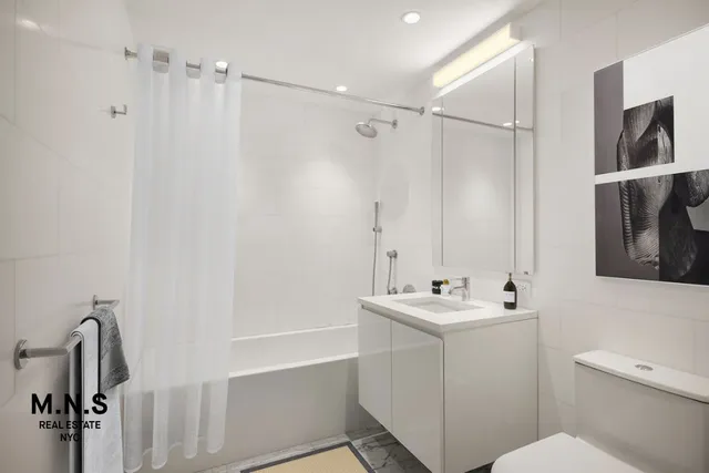 a view of a hallway with washer and dryer