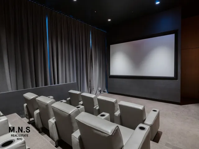 a view of a kitchen with kitchen island a dining table and chairs