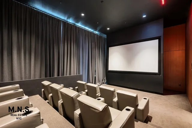 a view of a living room and a kitchen with a sink