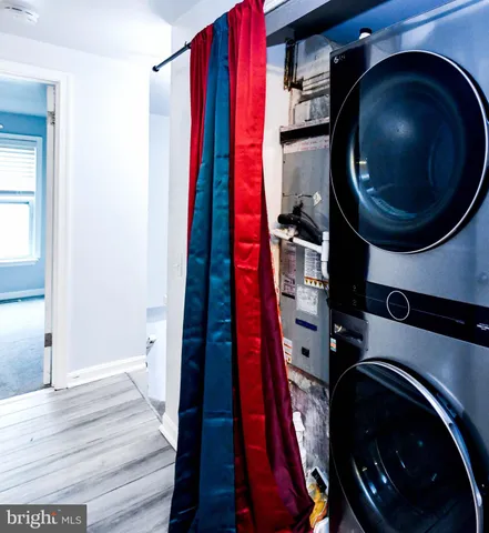 a view of a hallway with washer and dryer