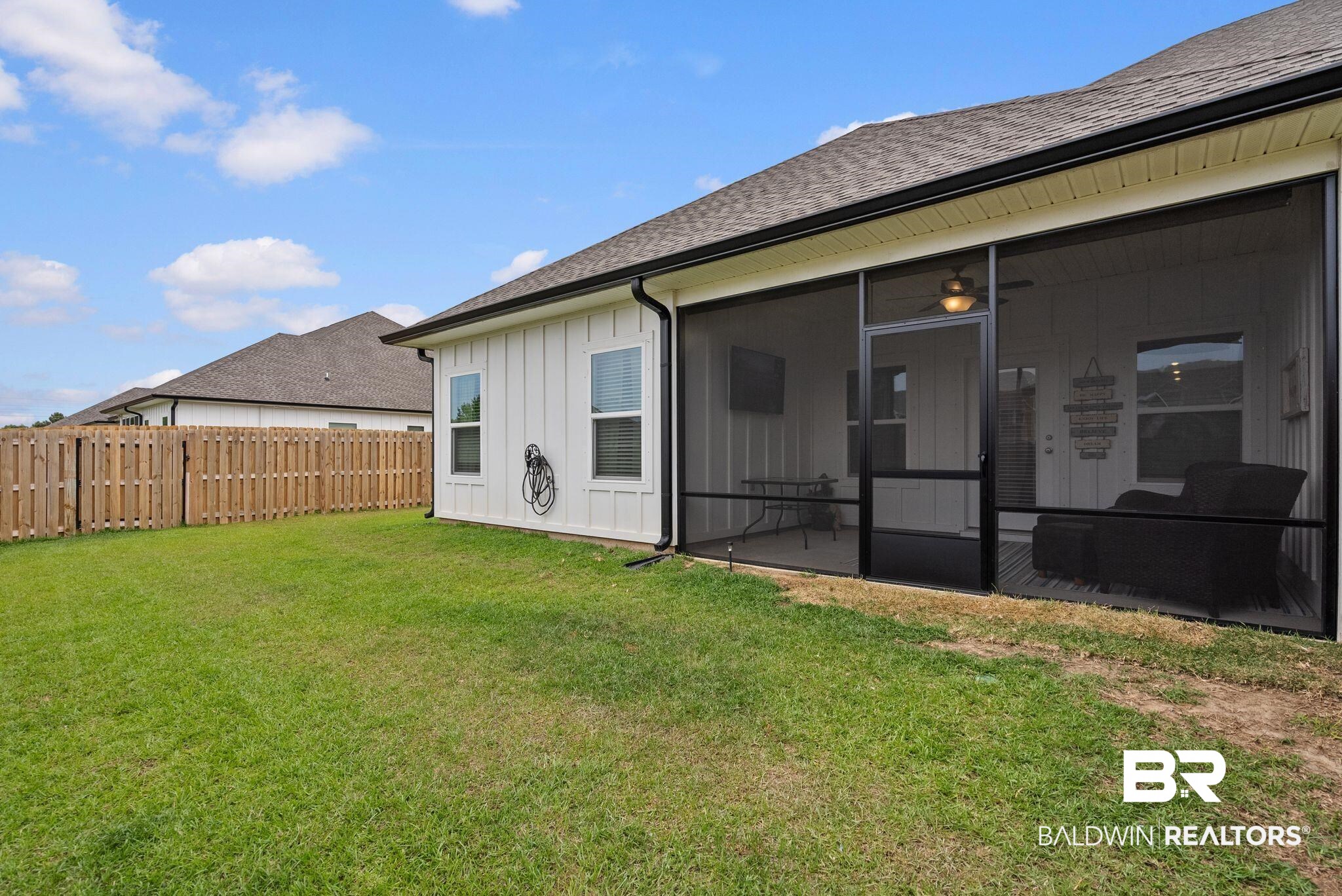 9899 Willet Way Foley, AL 36535 - Photo 31 of 37 Expansive backyard with a full privacy fence and a screened-in porch