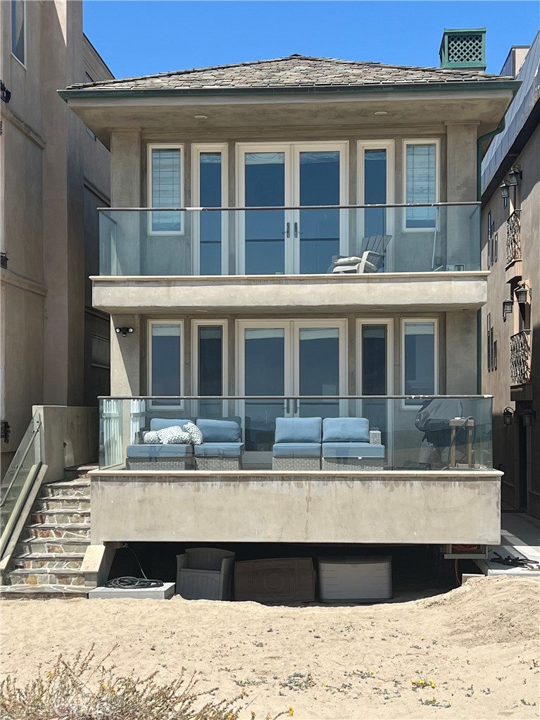 104 Surfside Avenue Surfside, CA 90743 - Photo 1 of 1 a view of a house with a swimming pool