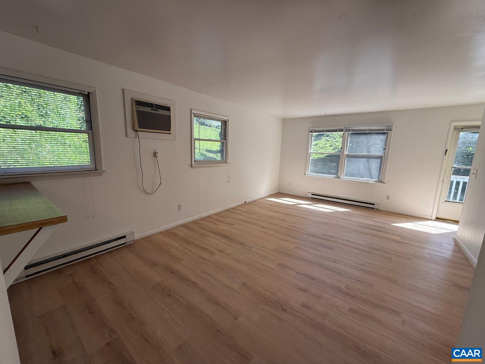 301 Paton Street, Unit A & B Charlottesville, VA 22903 - Photo 12 of 40 a view of empty room with wooden floor and fan